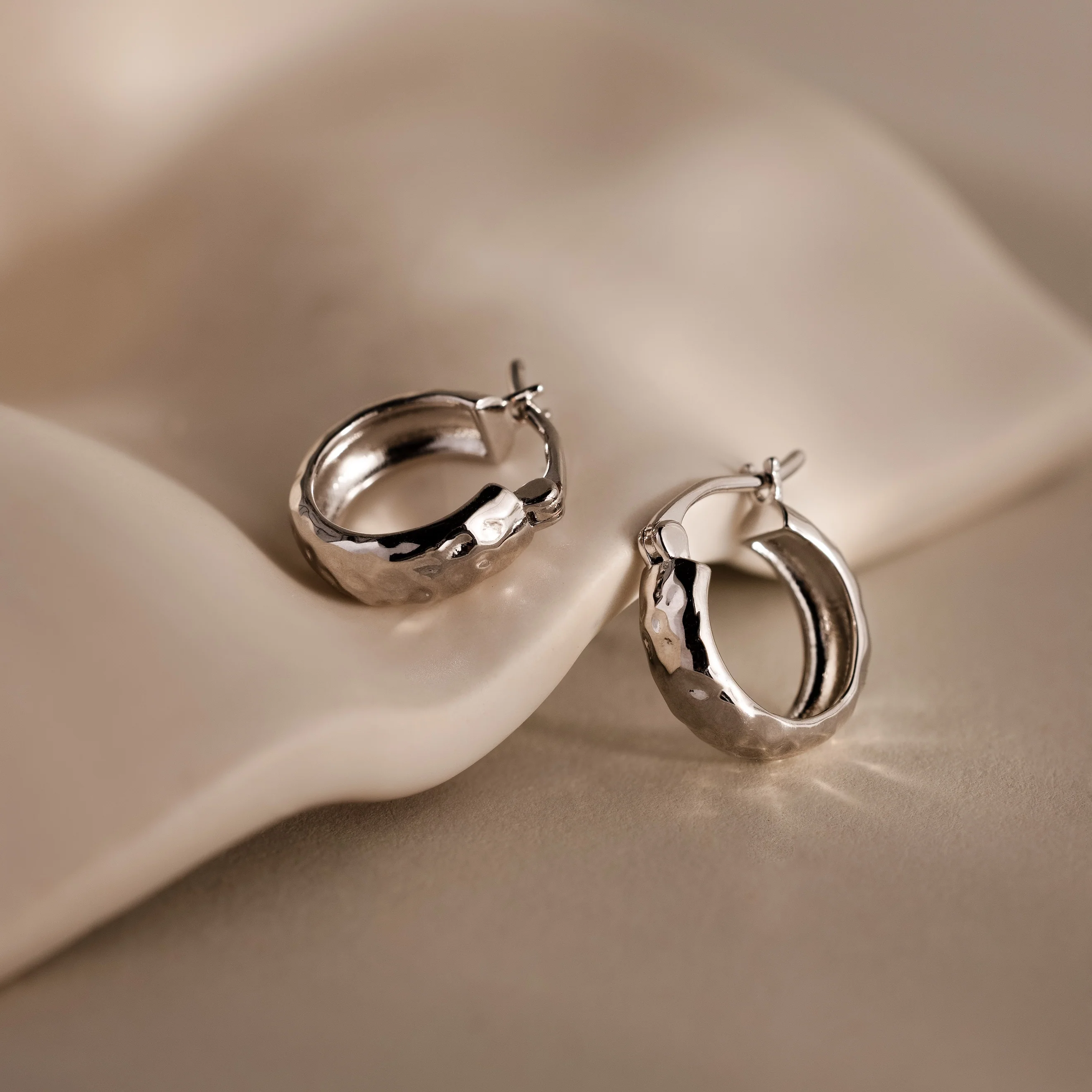 Bold Hammered Huggies in Silver - Image 4