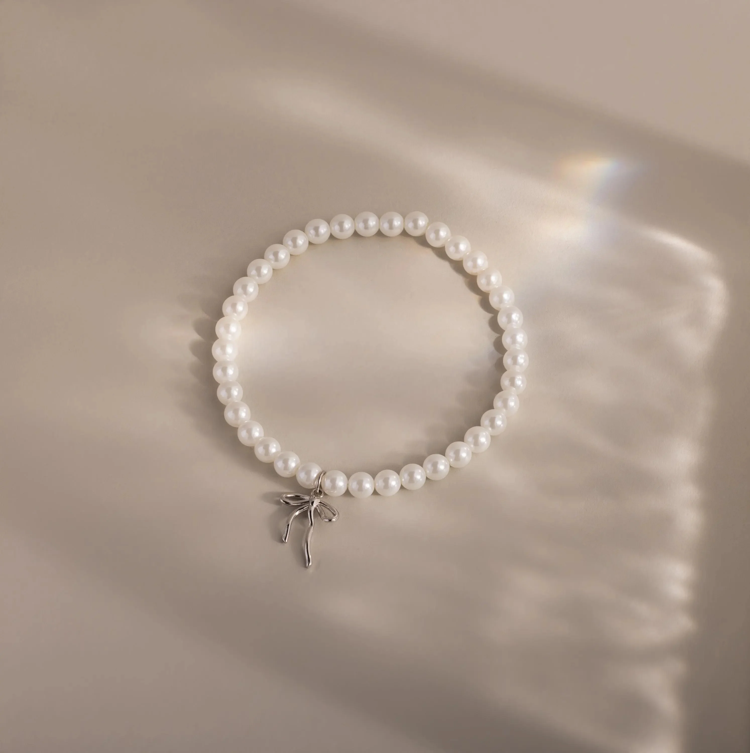 Bow Pearl Bracelet in Silver