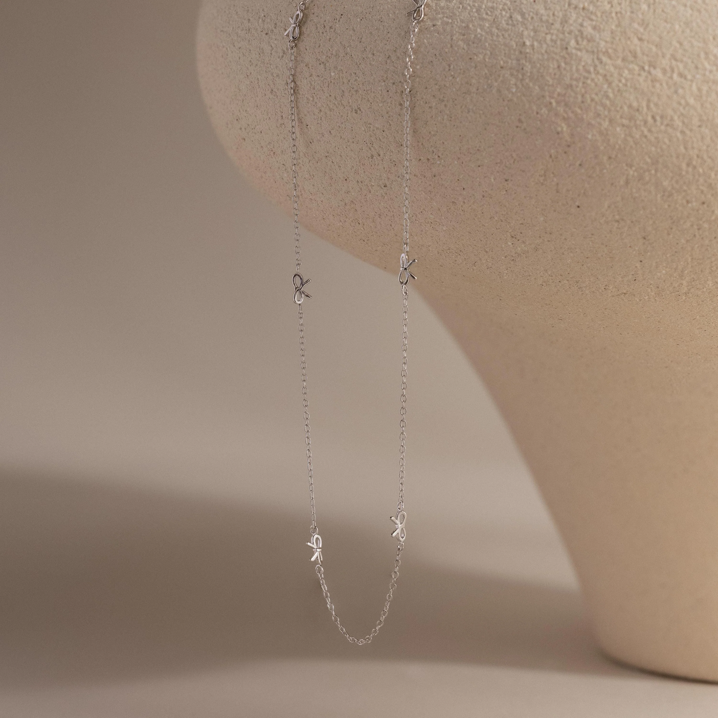 Bow Station Necklace in Silver