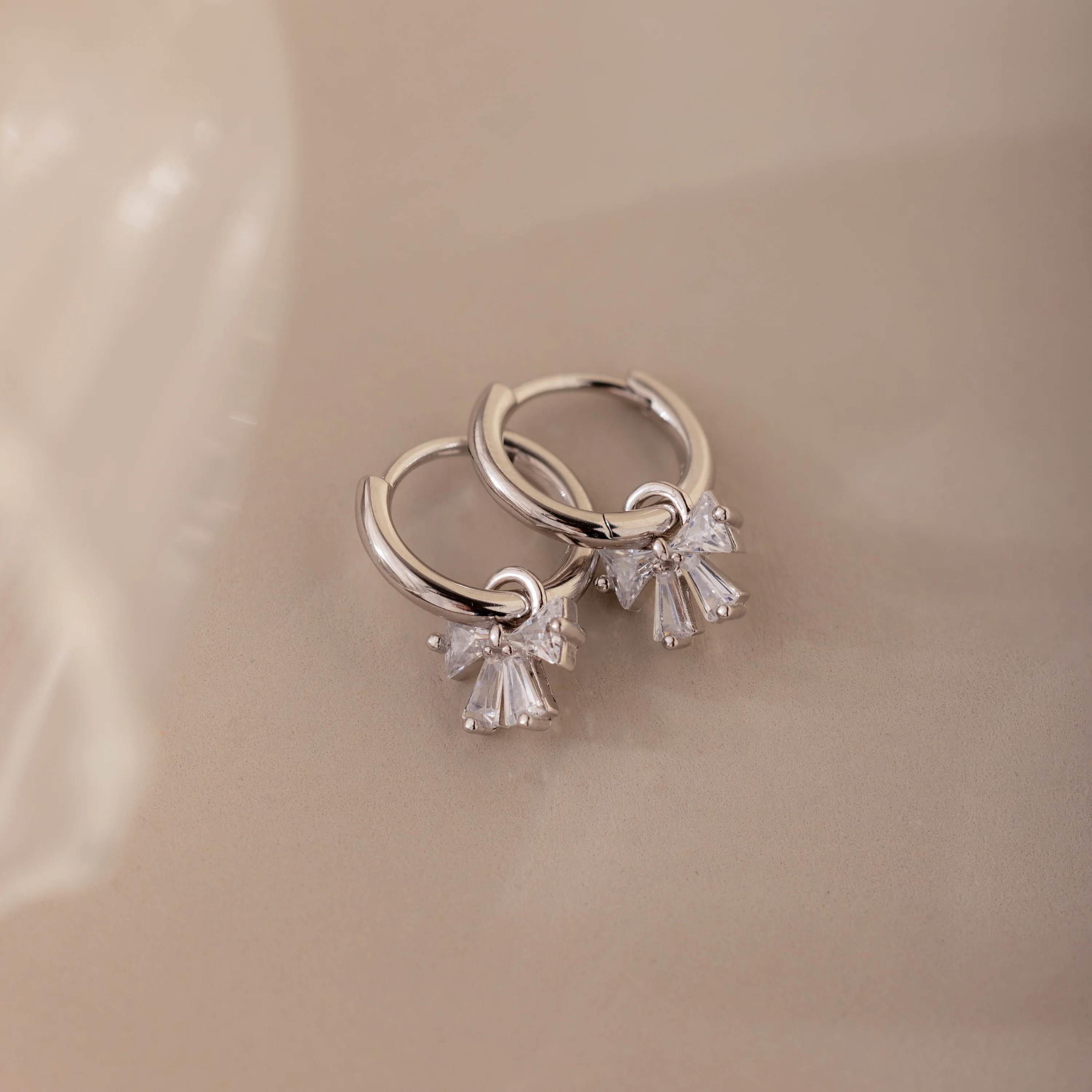 Diamond Bow Hoops in Silver - Image 3