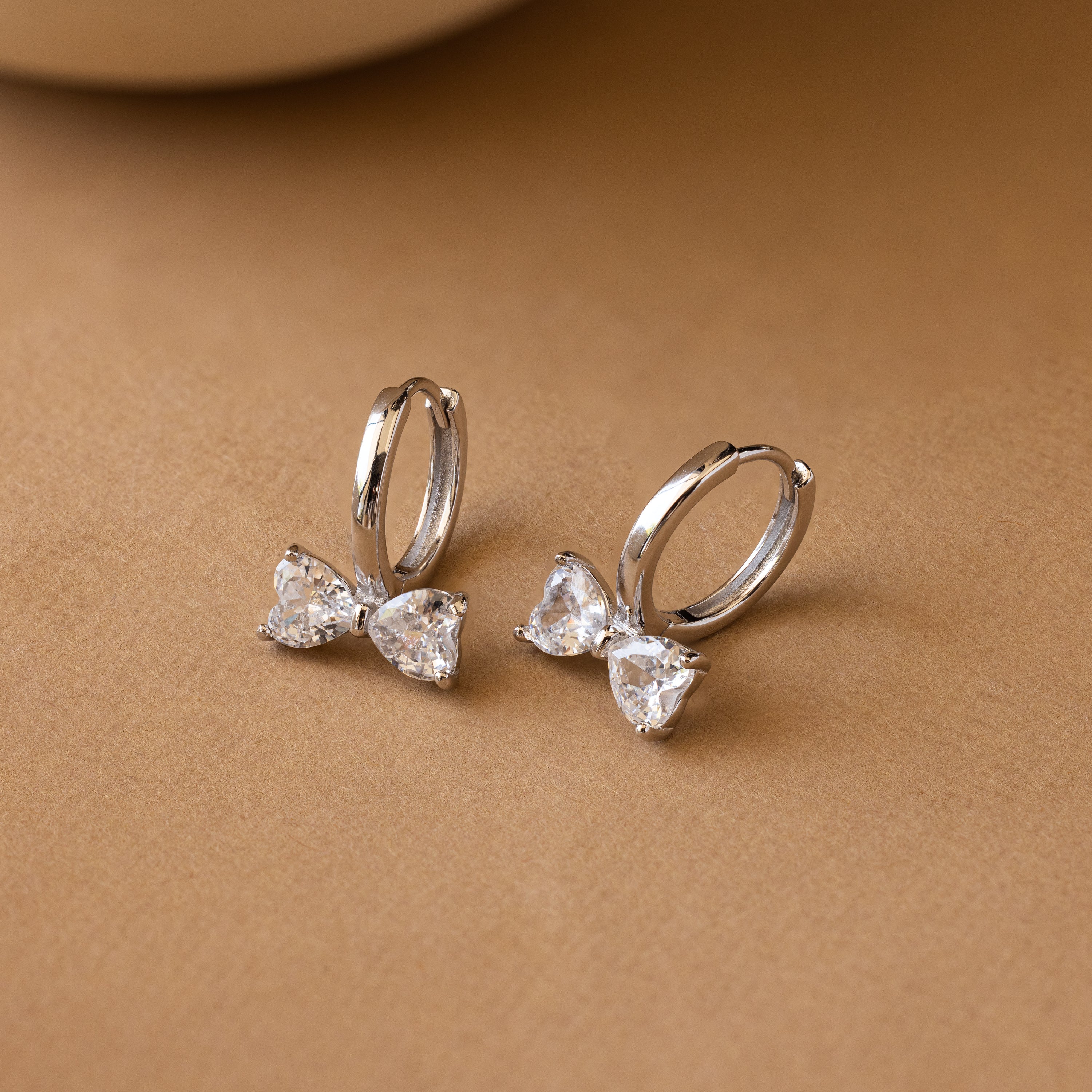 Diamond Bow Huggies in Silver - Image 2