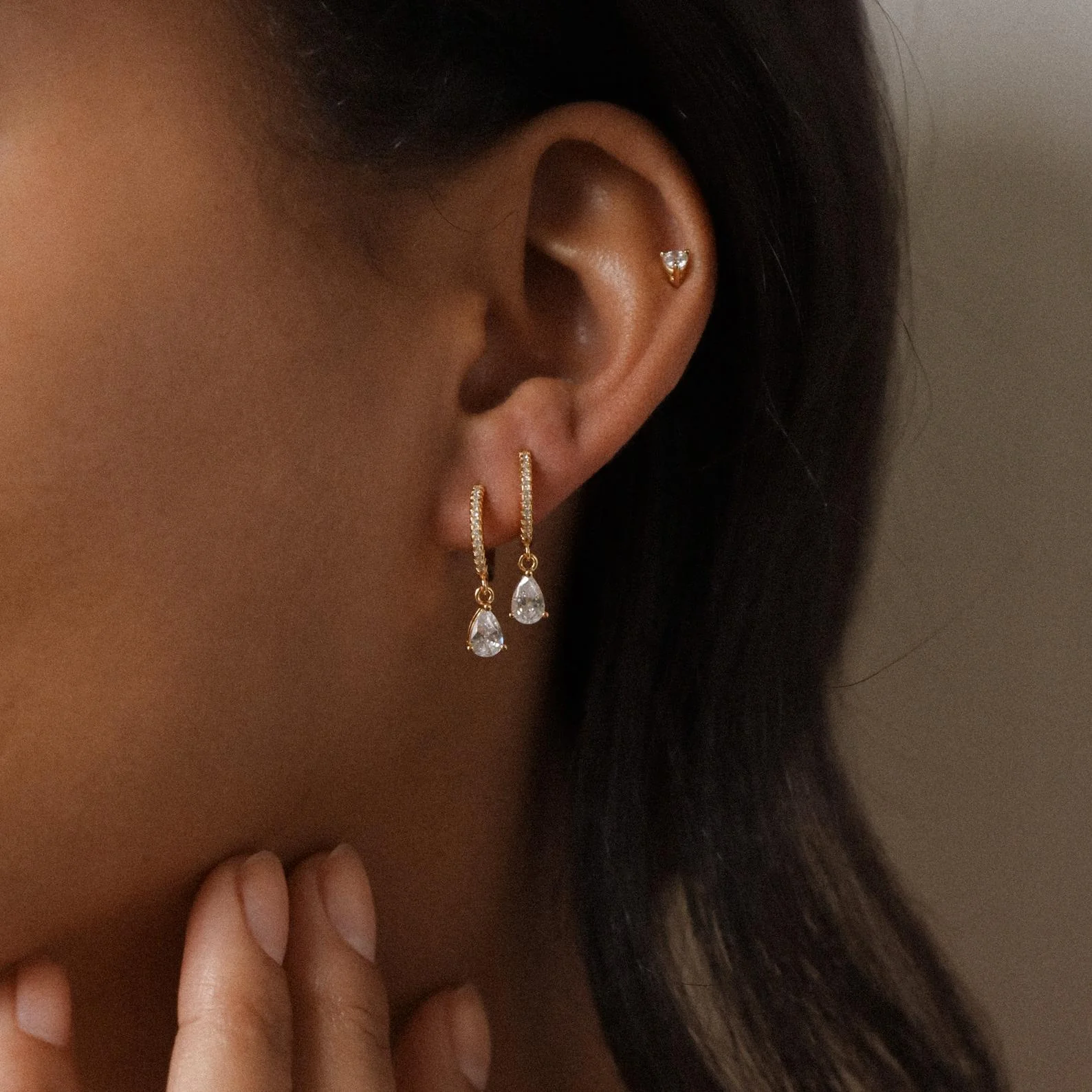 Diamond Drop Huggies in 18K Gold - Image 4