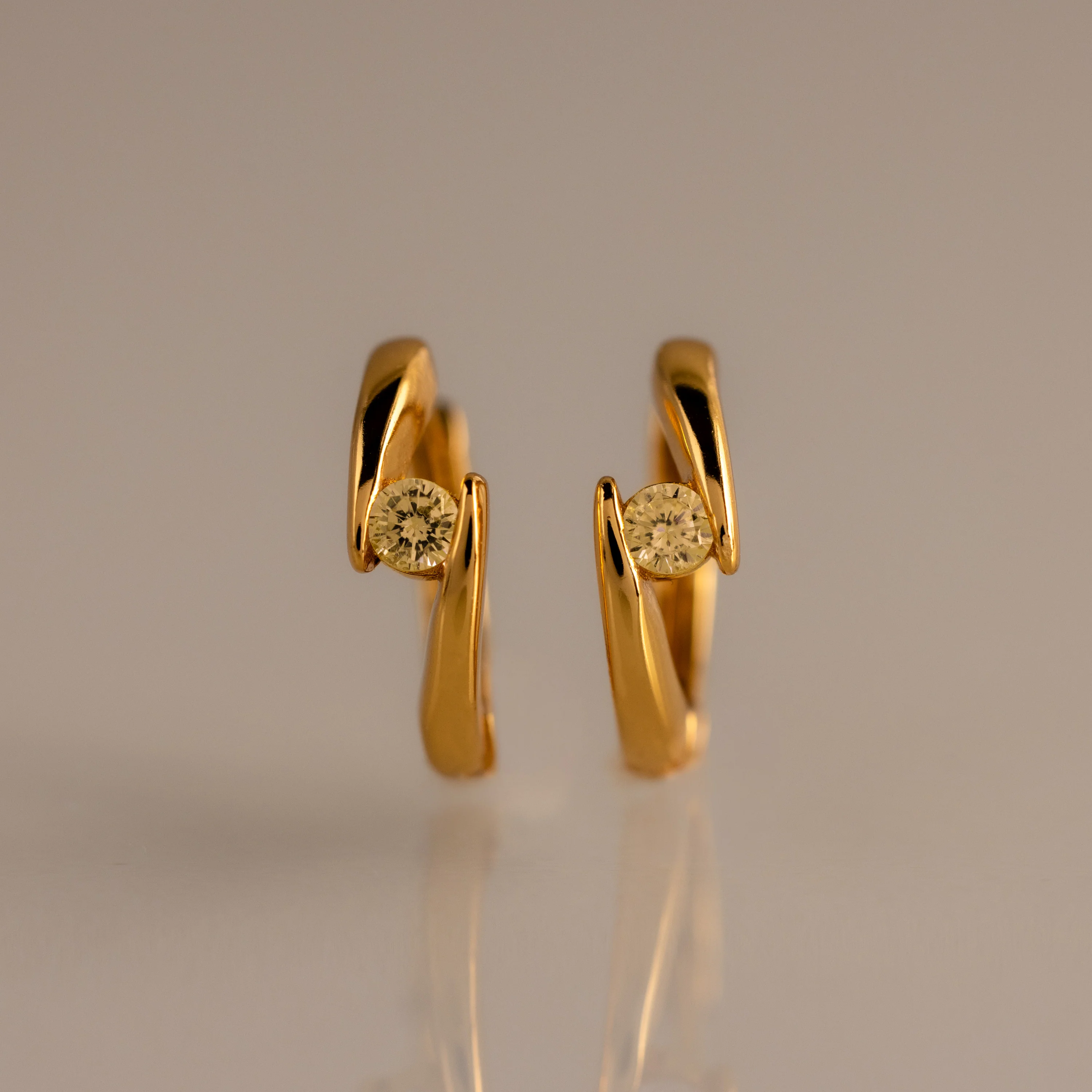 Floating Topaz Huggies