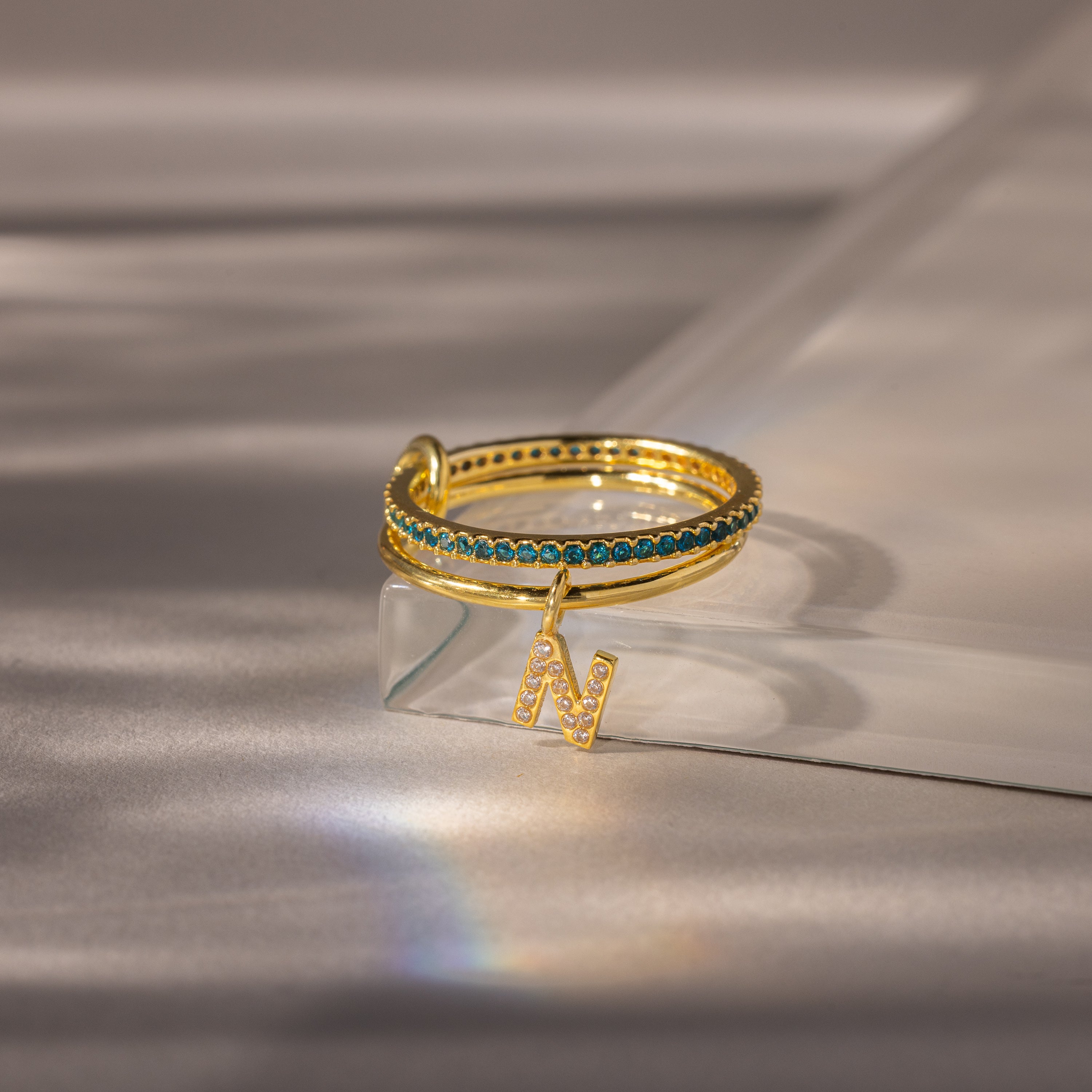 Linked Initial Blue Zircon Ring Set