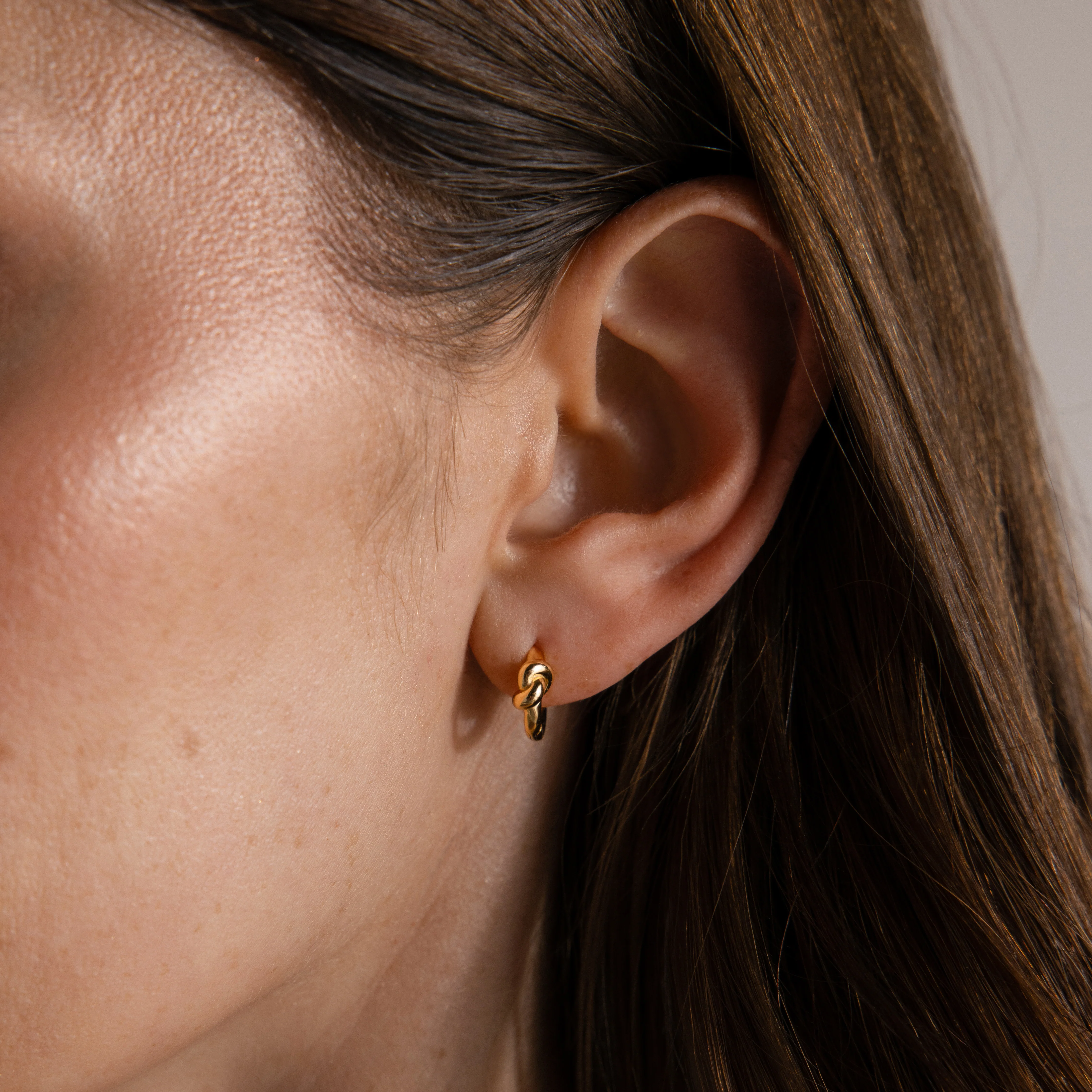 Love Knot Huggies in 18K Gold - Image 2