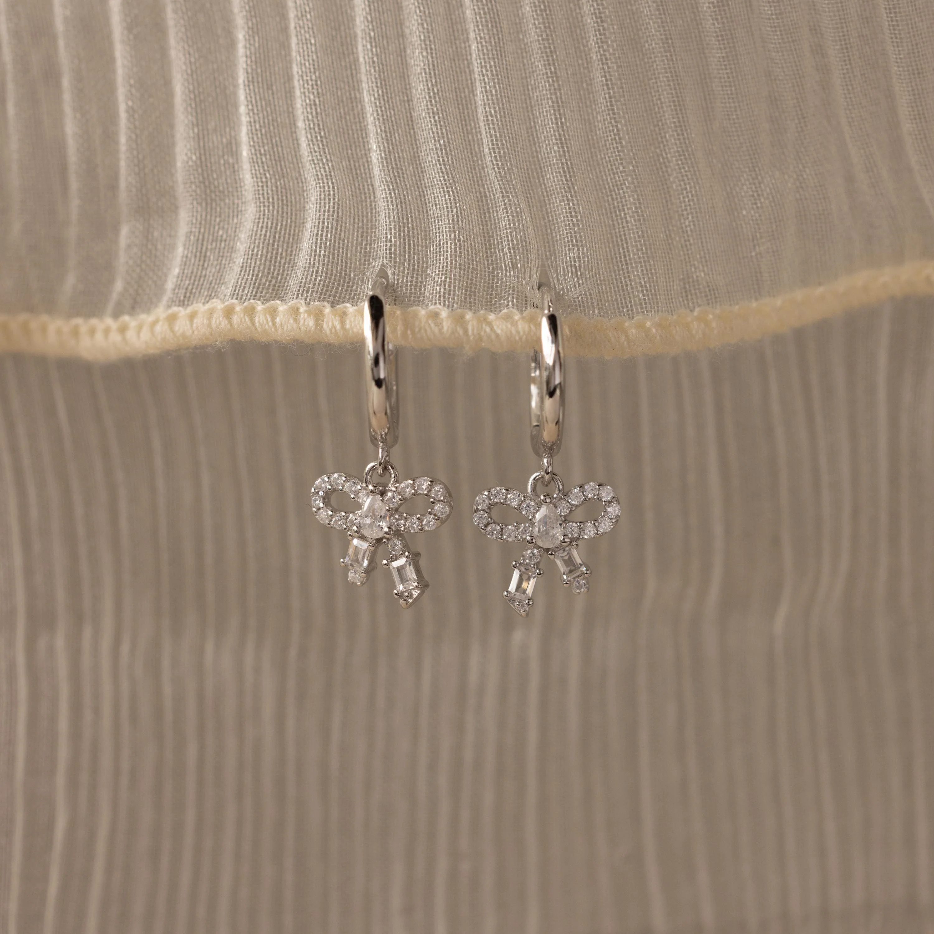 Pave Bow Charm Hoops in Silver - Image 3